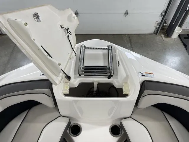 Slide: The Image of 2018 Yamaha Boats 212 Limited S bow storage with ladder and seating. - 18