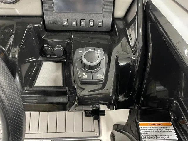Slide: The Image of Control panel of 2018 Yamaha Boats 212 Limited S, featuring navigation and control knobs. - 29