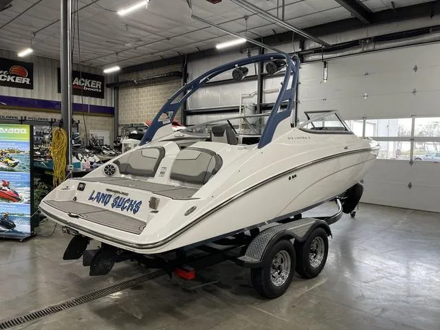 Slide: The Image of 2018 Yamaha Boats 212 Limited S on trailer in indoor showroom. - 3