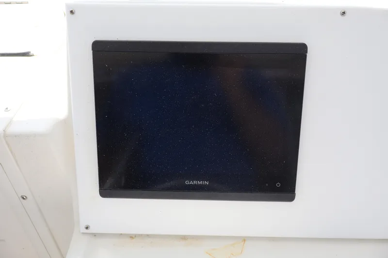 Slide: The Image of Garmin display on 2005 Sea Boss 235 Walkaround boat dashboard. - 12