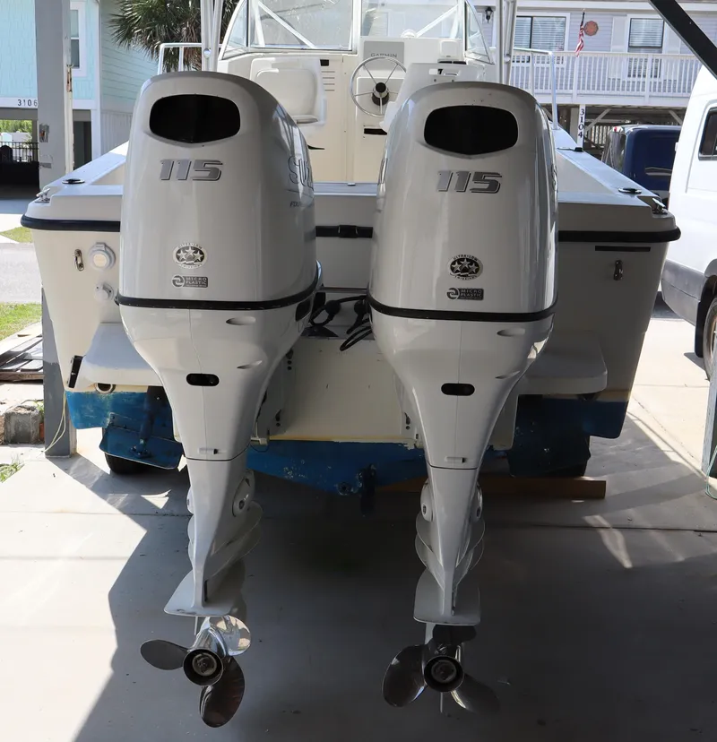 Slide: The Image of 2005 Sea Boss 235 Walkaround with twin 115 horsepower outboard engines. - 4