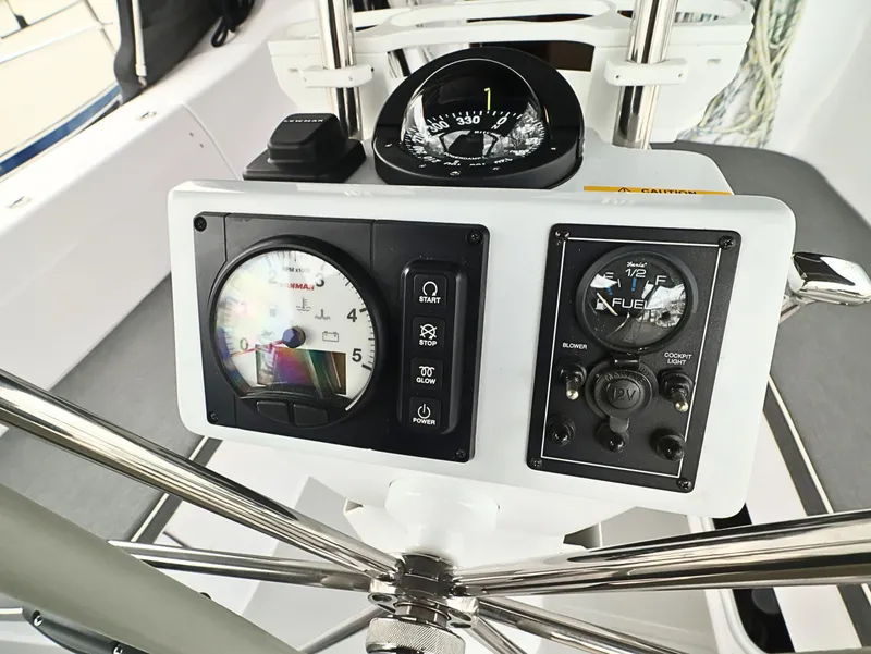 Slide: The Image of Steering console of 2021 Catalina C355 sailboat with navigation instruments and controls. - 15
