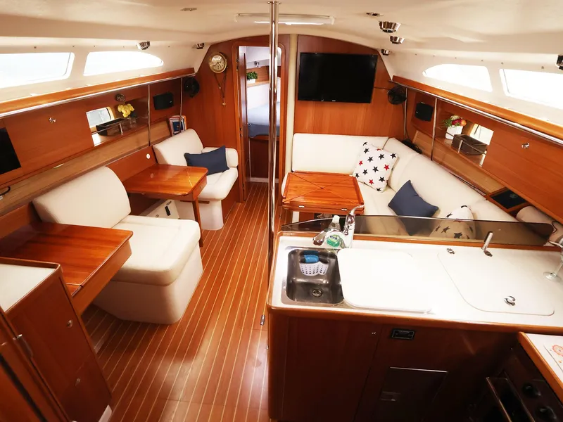 Slide: The Image of Luxurious interior of 2021 Catalina C355 yacht with wood finish and cozy seating. - 20