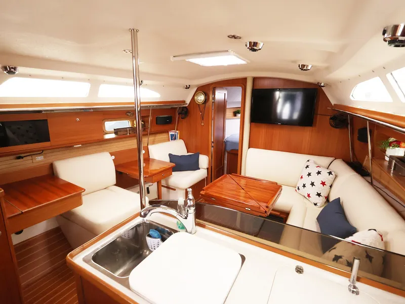Slide: The Image of Luxurious interior of 2021 Catalina C355 yacht with modern amenities and elegant wood finish. - 21
