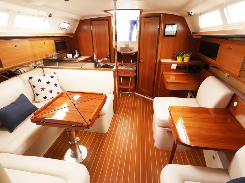 Slide: The Image of Luxurious Catalina C355 2021 yacht interior with wooden finish and comfortable seating. - 22
