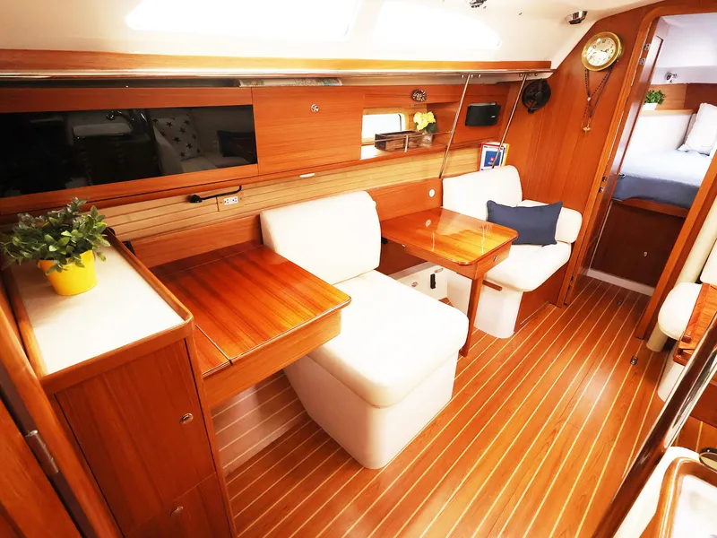 Slide: The Image of Luxurious interior of 2021 Catalina C355 yacht with wooden finish and comfortable seating. - 27