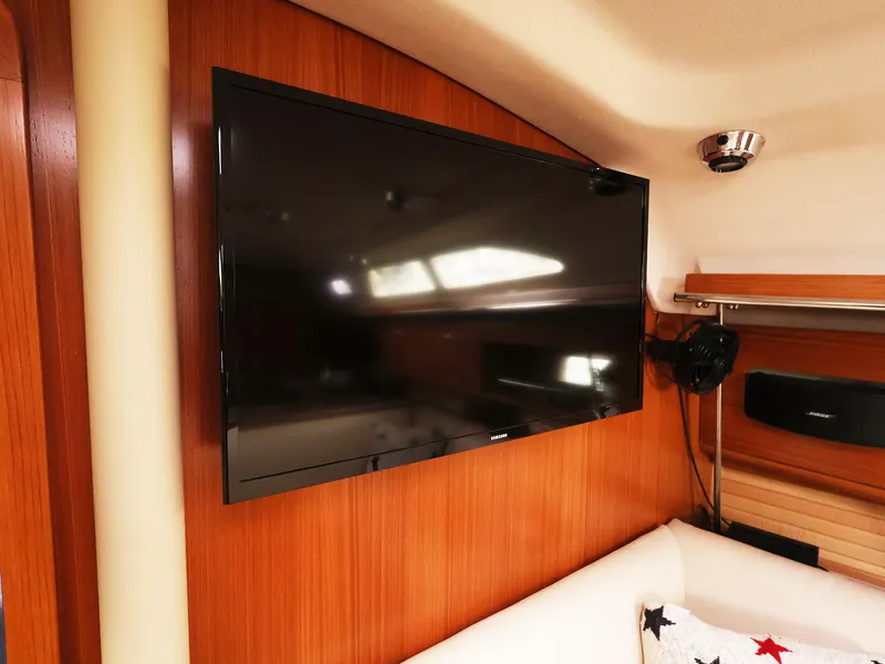 Slide: The Image of Flat-screen TV in 2021 Catalina C355 yacht interior, mounted on wooden paneling. - 28