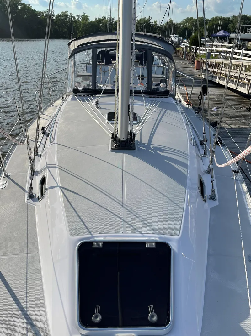 Slide: The Image of Sleek 2021 Catalina C355 sailboat docked, showcasing its modern deck design and rigging. - 3