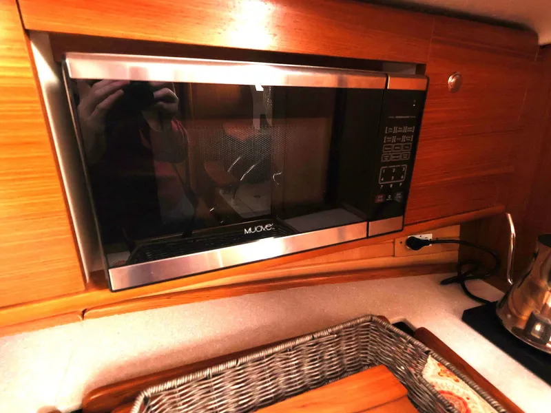Slide: The Image of Microwave in 2021 Catalina C355 yacht kitchen with wooden cabinetry. - 30