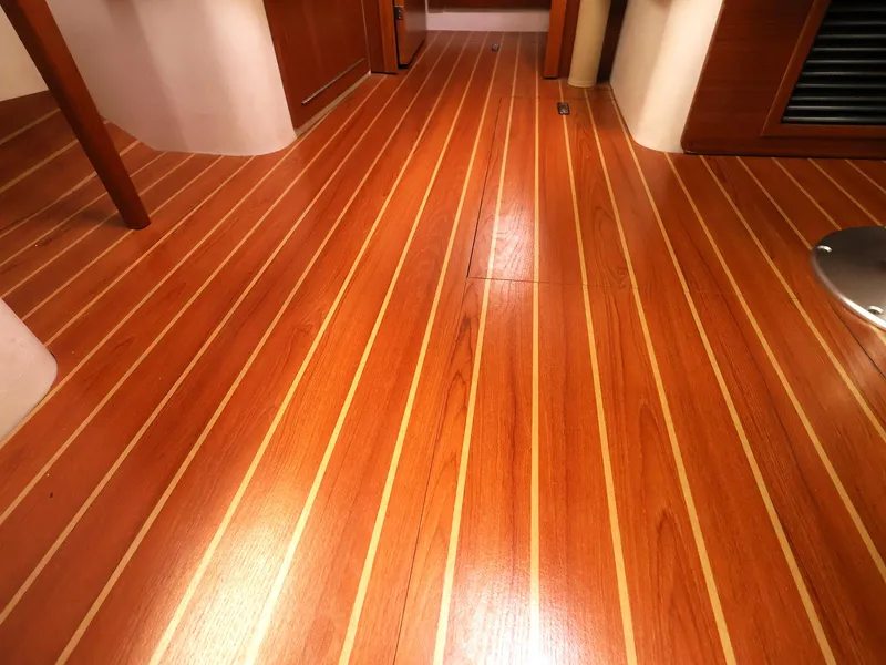 Slide: The Image of Polished wooden flooring inside a 2021 Catalina C355 yacht cabin. - 33