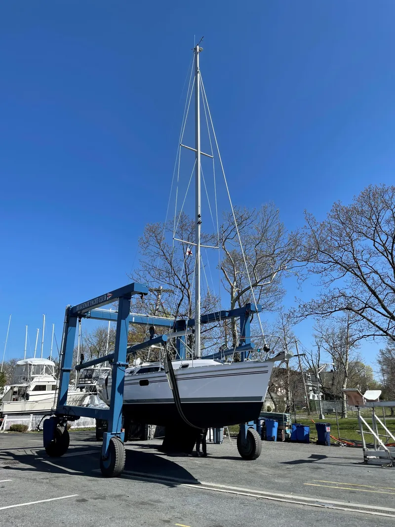 Slide: The Image of Catalina C355 sailboat on a lift, clear blue sky, 2021 model. - 5