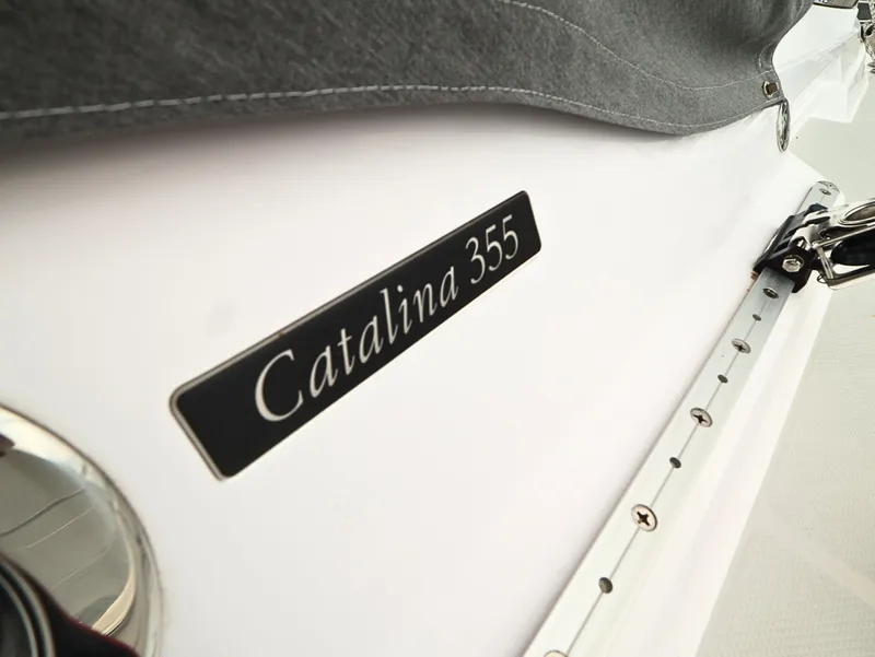 Slide: The Image of Catalina C355 sailboat, 2021 model, close-up of nameplate and deck details. - 9
