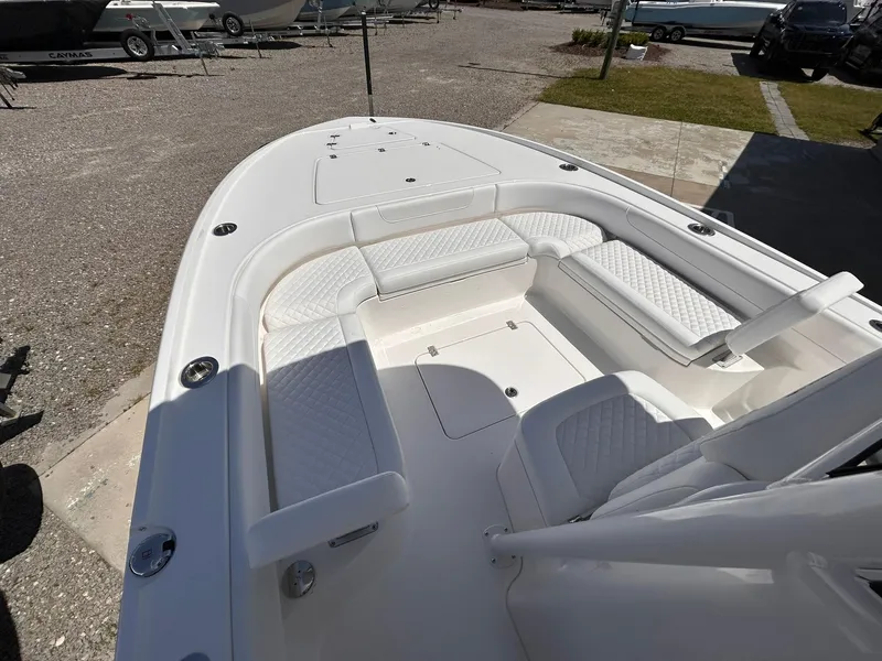 Slide: The Image of 2025 Caymas 26 HB boat with spacious white seating and sleek design. - 5