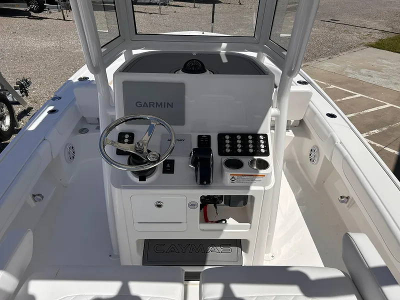 Slide: The Image of 2025 Caymas 26 HB boat console with Garmin system and steering wheel. - 7