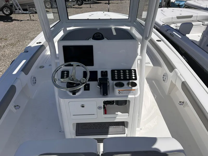 Slide: The Image of 2025 Caymas 28 HB boat console with steering wheel and control panel. - 6