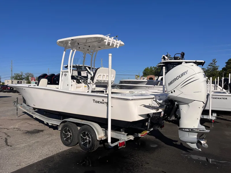 Slide: The Image of 2021 Tidewater 2500 Carolina Bay boat on trailer with Mercury outboard engine. - 2