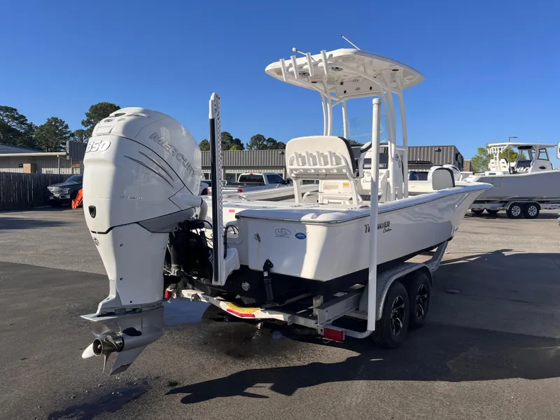 Slide: The Image of 2021 Tidewater 2500 Carolina Bay boat on trailer with powerful outboard motor. - 4