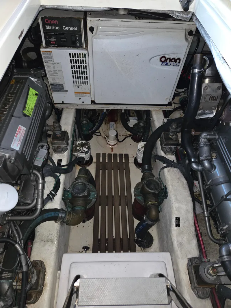 Slide: The Image of Engine compartment of a 2007 Sabre 34 Hardtop Express boat, featuring Onan Marine Genset. - 15
