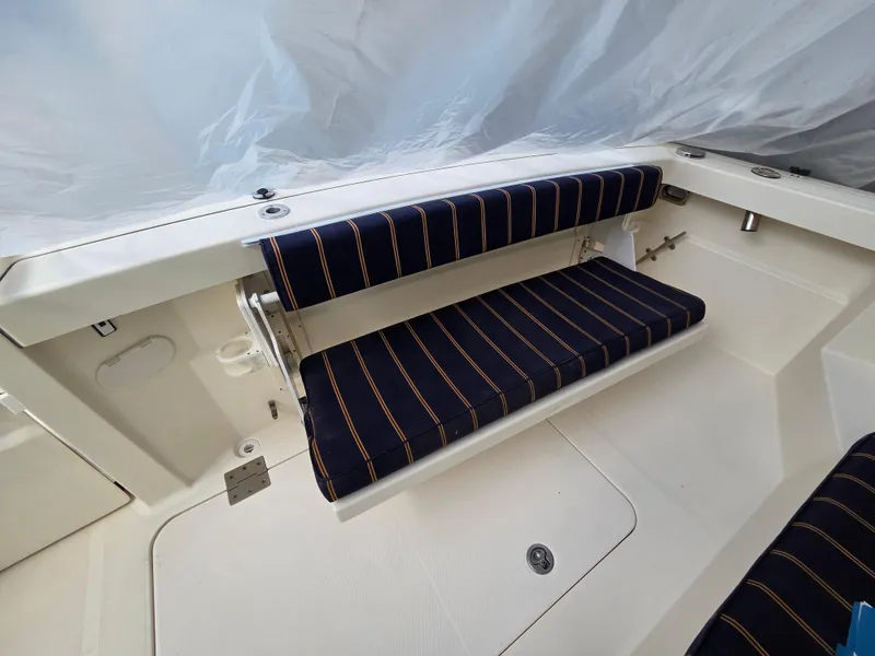 Slide: The Image of 2007 Sabre 34 Hardtop Express boat with striped seating in the cockpit area. - 17