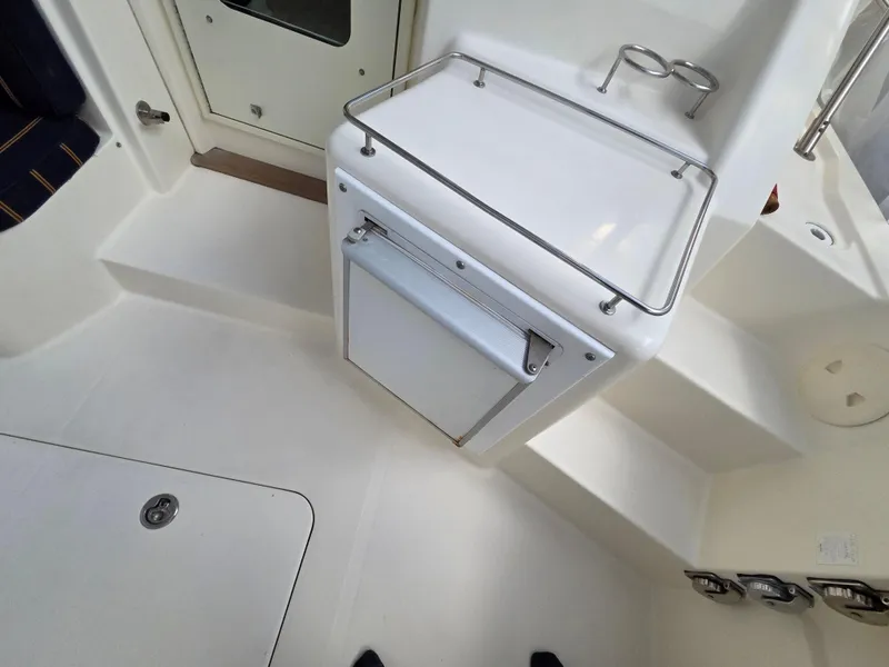 Slide: The Image of 2007 Sabre 34 Hardtop Express interior with white cabinetry and seating area. - 18