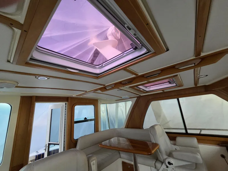 Slide: The Image of Interior of 2007 Sabre 34 Hardtop Express with skylights and seating area. - 8