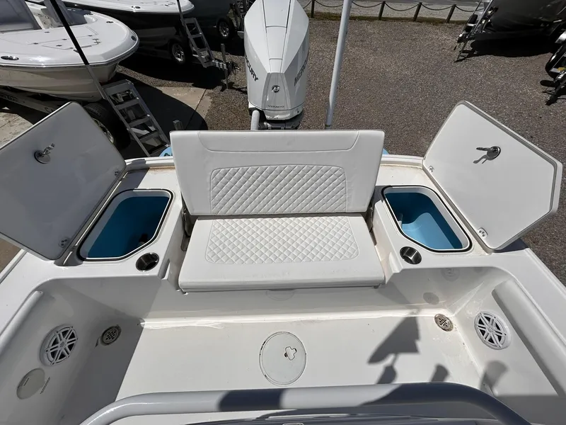 Slide: The Image of 2025 Caymas 26 HB boat interior with seating and storage compartments. - 11