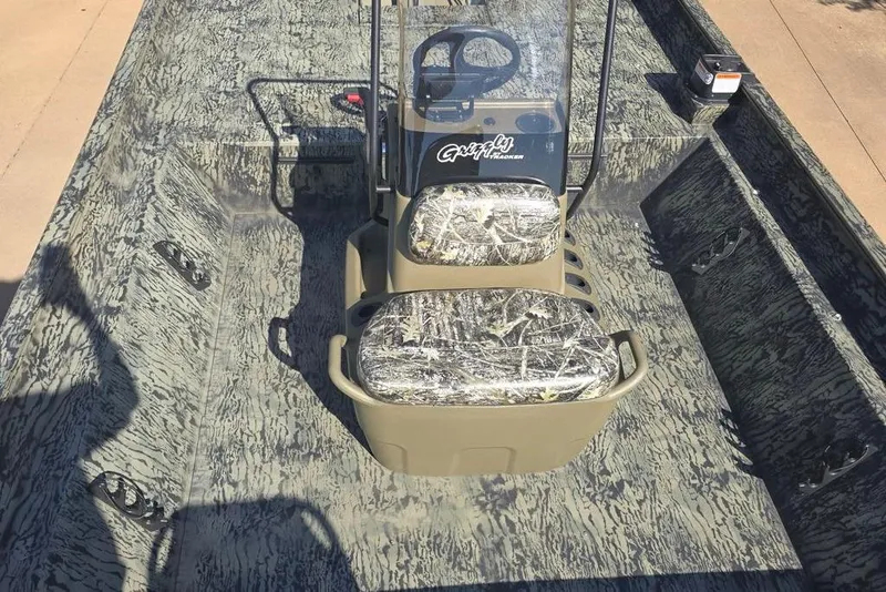 Slide: The Image of 2025 Tracker Grizzly 2072 CC boat with camouflage seats and steering console. - 4