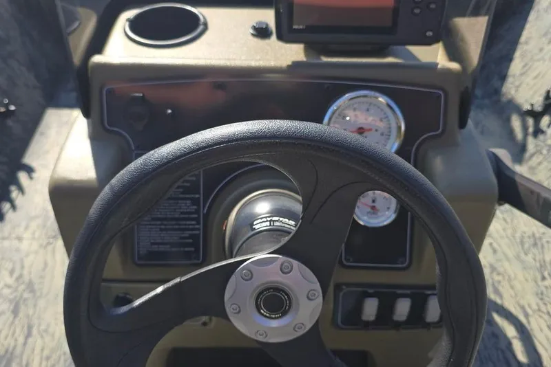 Slide: The Image of Steering console of 2025 Tracker Grizzly 2072 CC boat with gauges and controls. - 5