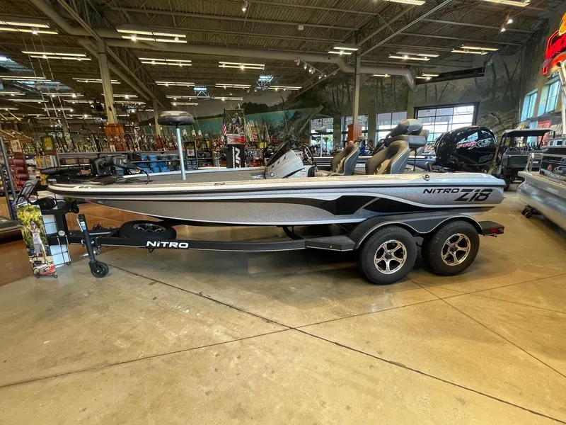 Slide: The Image of 2024 Nitro Z18 boat displayed indoors on a trailer. - 0