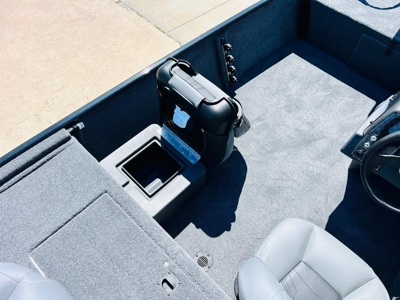 Slide: The Image of 2025 Tracker Bass Tracker Classic XL interior with seating and storage compartments. - 14