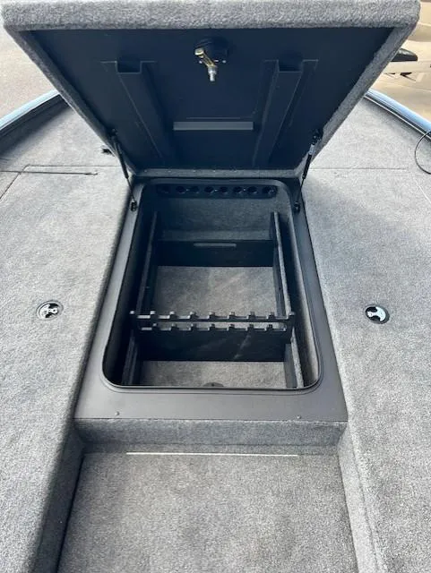 Slide: The Image of 2025 Tracker Savage 215 boat storage compartment with open lid, showcasing interior space. - 7