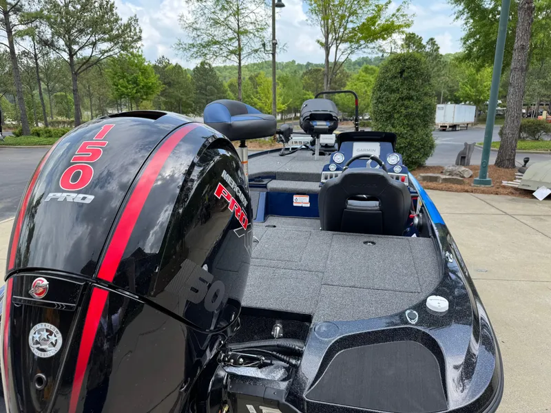 Slide: The Image of 2025 Nitro Z18 Pro boat with 150 Pro engine, parked outdoors. - 3