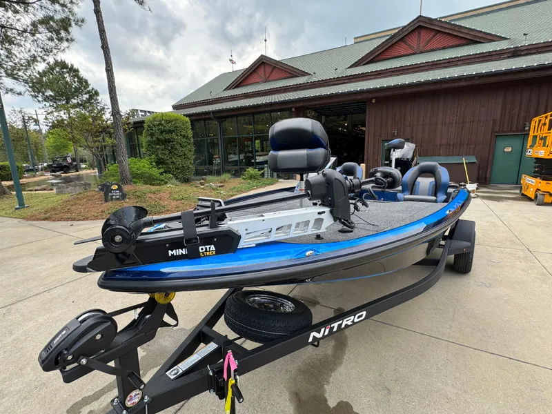 Slide: The Image of 2025 Nitro Z18 Pro boat on trailer, parked outside a building. - 4