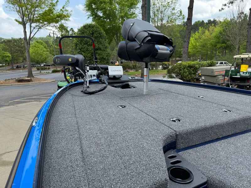Slide: The Image of 2025 Nitro Z18 Pro boat deck with advanced fishing equipment and lush green background. - 5