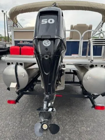 Slide: The Image of 2025 Sun Tracker Bass Buggy 16 XL Select with 50 HP outboard motor, rear view. - 3