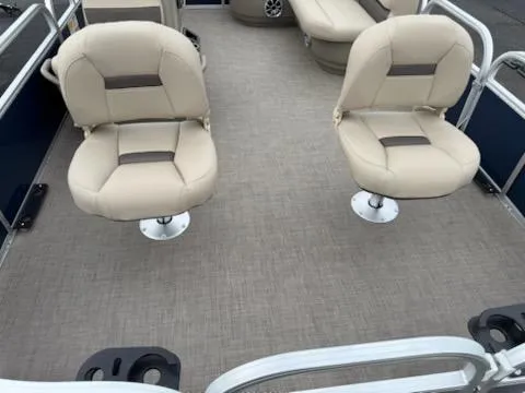 Slide: The Image of 2025 Sun Tracker Bass Buggy 16 XL Select pontoon boat interior with beige seating. - 5