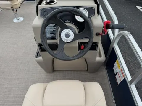 Slide: The Image of Steering console of 2025 Sun Tracker Bass Buggy 16 XL Select pontoon boat. - 7