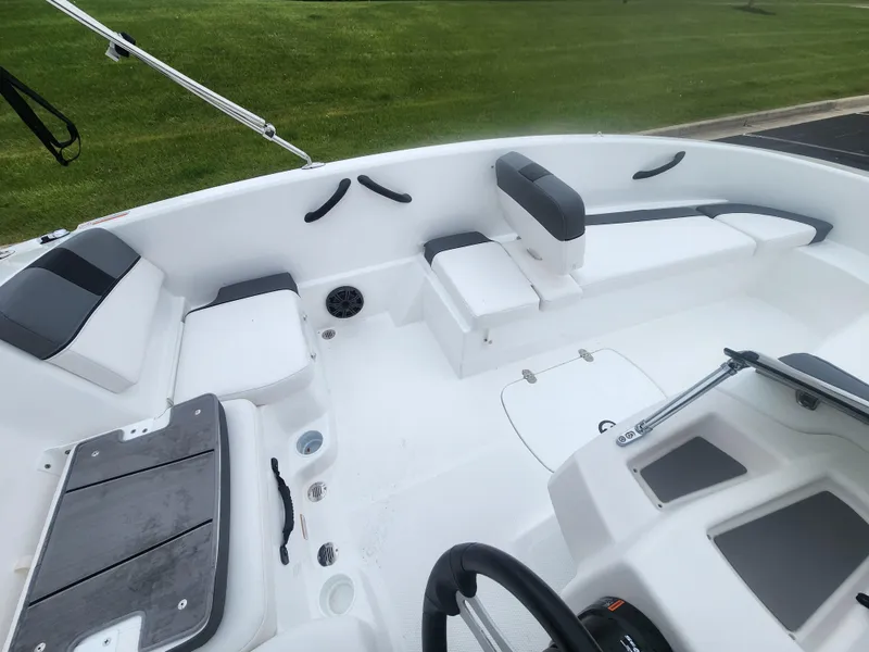 Slide: The Image of 2025 Tahoe T16 boat interior with white seating and black accents, showcasing modern design. - 3