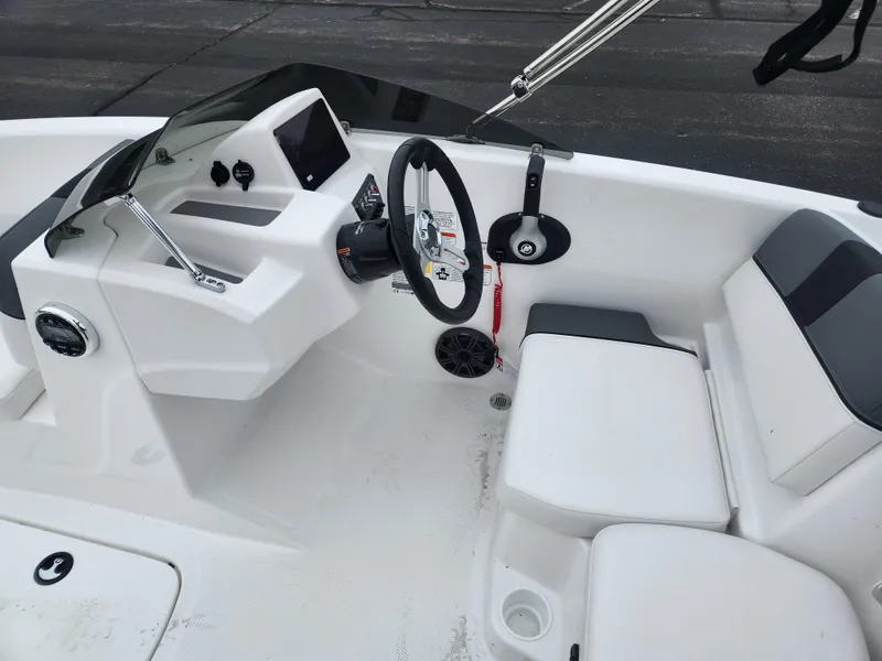 Slide: The Image of 2025 Tahoe T16 boat interior with steering wheel and seating, featuring modern design elements. - 5