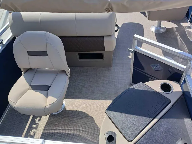 Slide: The Image of 2025 Sun Tracker Fishin' Barge 20 DLX interior with seating and console. - 8