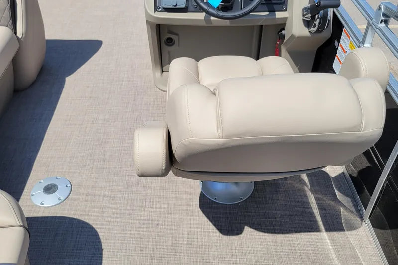 Slide: The Image of 2025 Sun Tracker SportFish 20 DLX boat interior with beige captain's chair and console. - 3