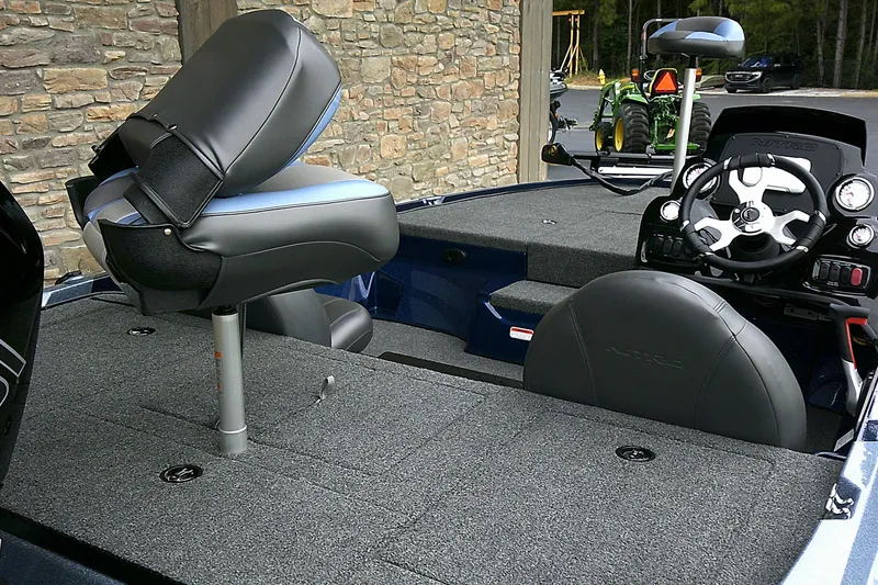 Slide: The Image of 2025 Nitro Z17 boat interior with steering wheel and seating, showcasing modern design. - 4