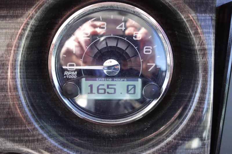 Slide: The Image of Close-up of 2018 Monterey 295 Sport Yacht tachometer showing 165 engine hours. - 12