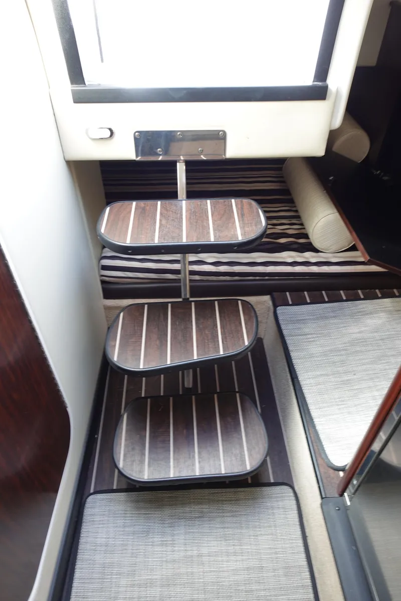 Slide: The Image of Interior stairs of 2018 Monterey 295 Sport Yacht with wooden steps and modern design. - 19