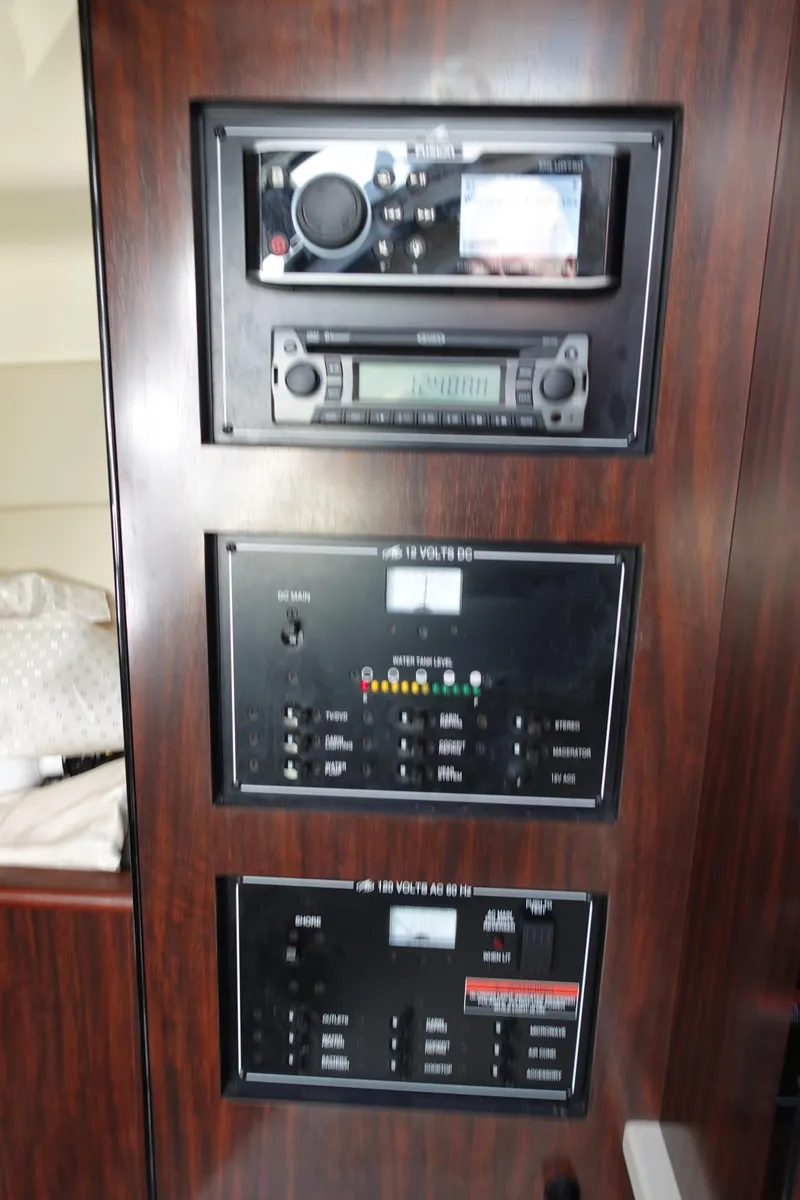 Slide: The Image of Control panel of 2018 Monterey 295 Sport Yacht with audio system and switches. - 26