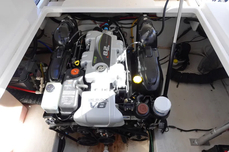 Slide: The Image of Engine compartment of a 2018 Monterey 295 Sport Yacht, featuring a powerful V8 engine. - 27