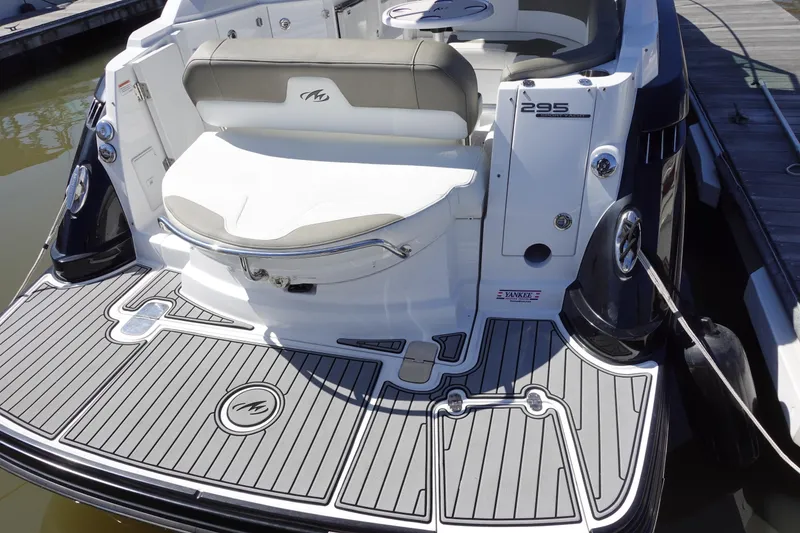Slide: The Image of 2018 Monterey 295 Sport Yacht rear view with swim platform and seating. - 5