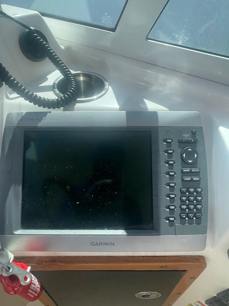 Slide: The Image of Garmin navigation system on 2010 Hunt Yachts Harrier 25 boat dashboard. - 16