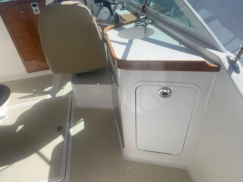 Slide: The Image of 2010 Hunt Yachts Harrier 25 interior with sink and seating area. - 24