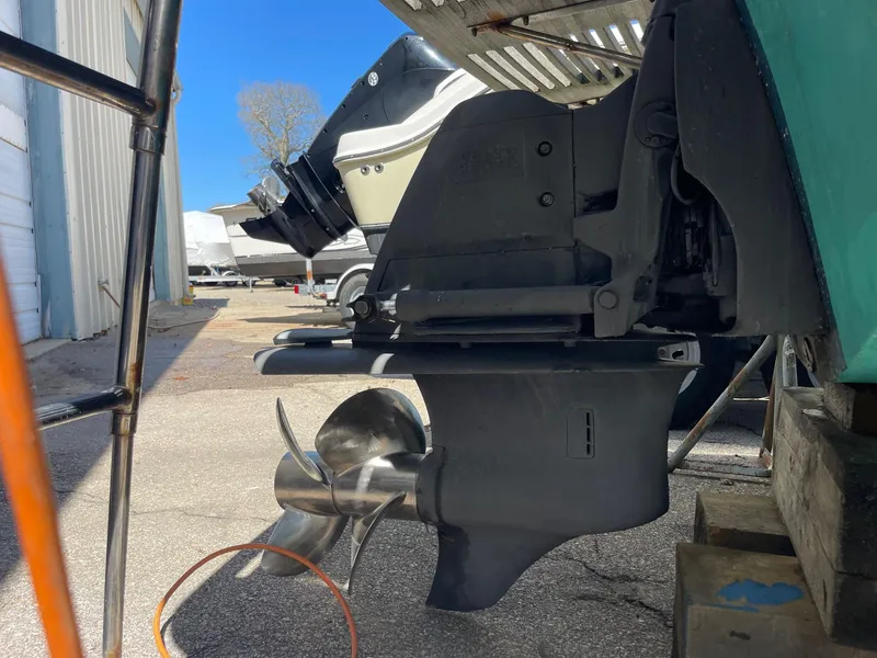 Slide: The Image of Outboard motor of 2010 Hunt Yachts Harrier 25, showcasing propeller and lower unit. - 7